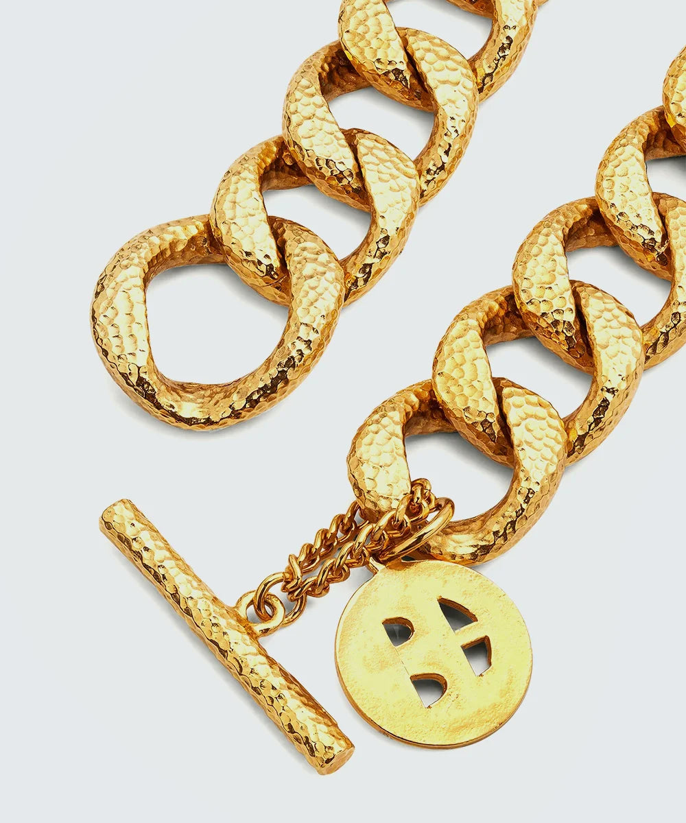 Gold Hammered Chain Necklace in a sleek high-contrast midnight luxury editorial style